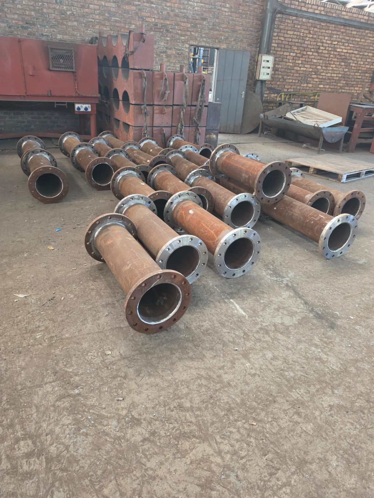 Short flanged steel spool pieces fabricated in the Wetpipe workshop